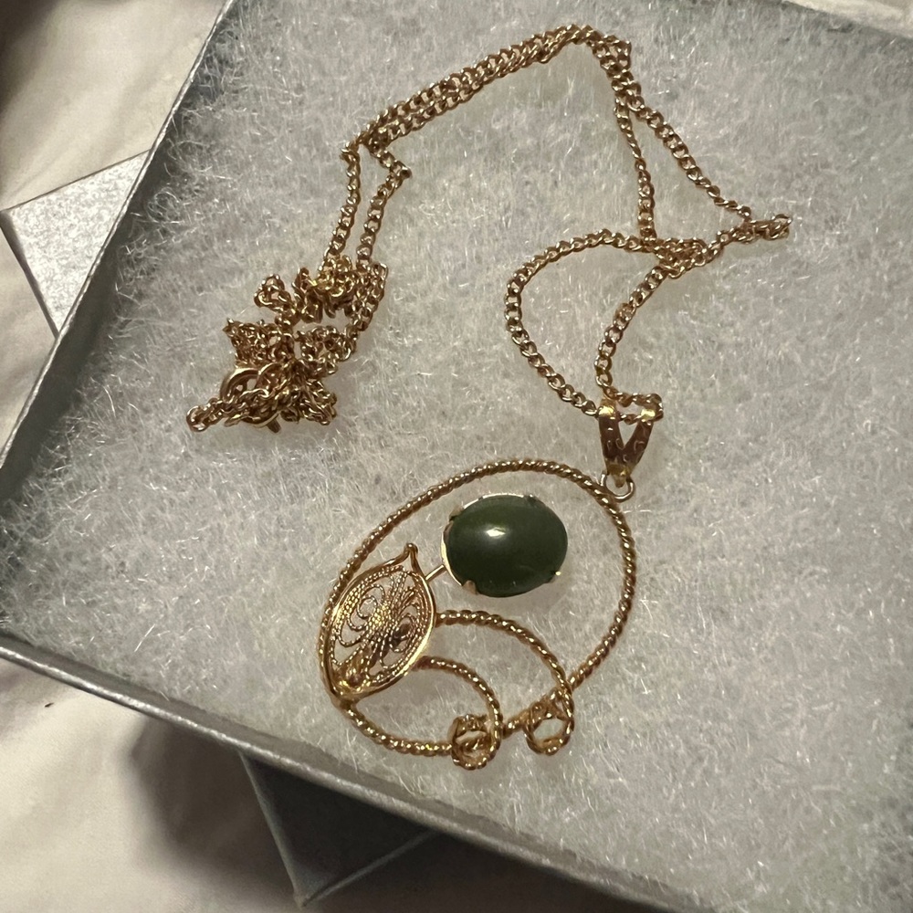 Necklace with olive green stone.